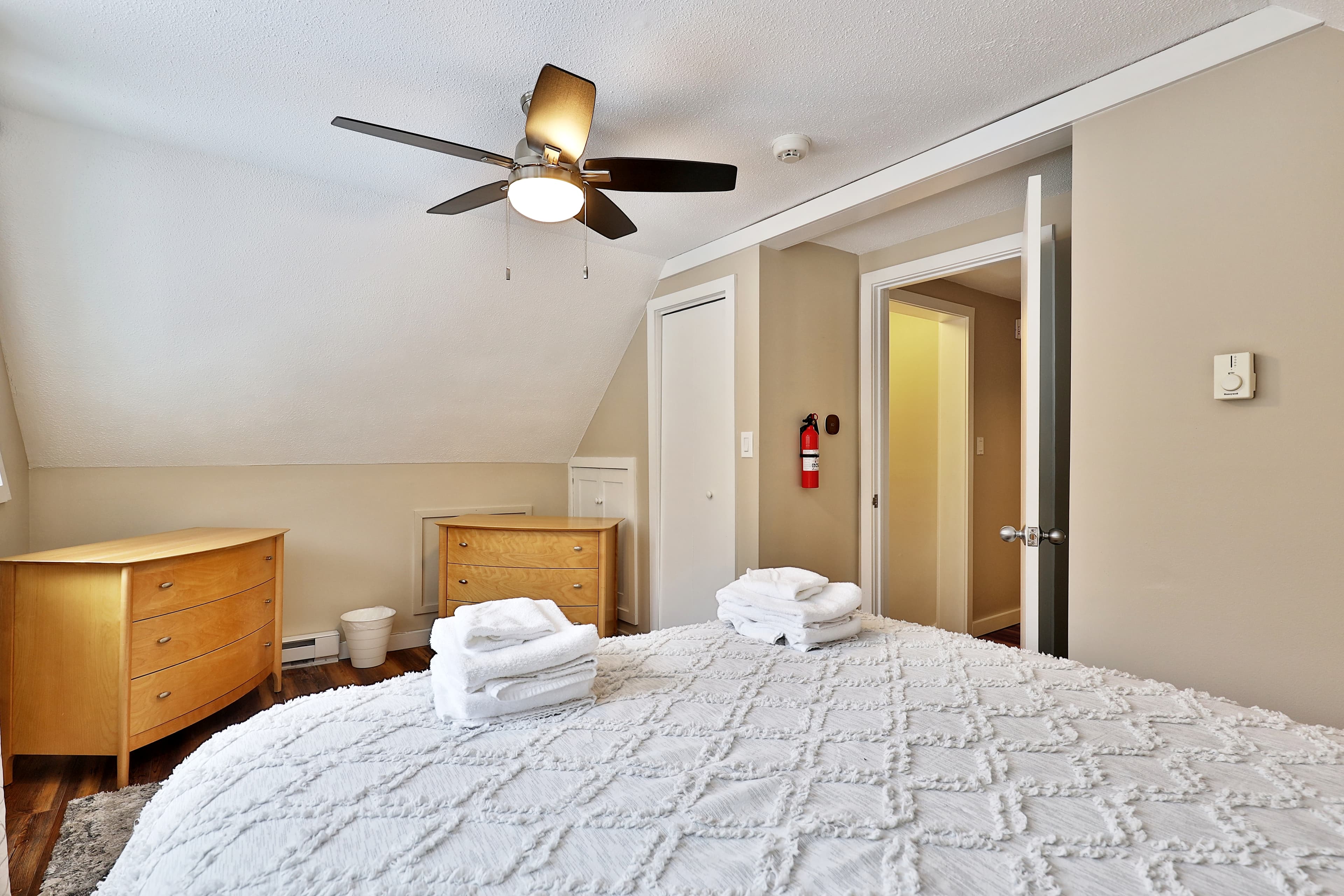 Bedroom with queen bed, bright and cheery