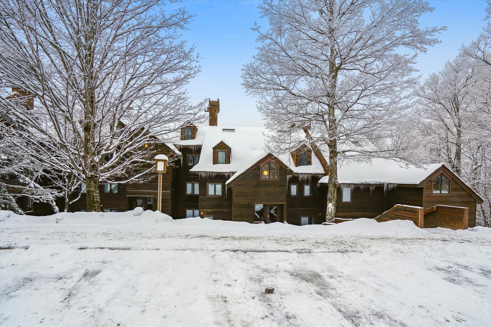 Classic alpine-style architecture surrounded by peaceful mountain scenery in the Highridge community.