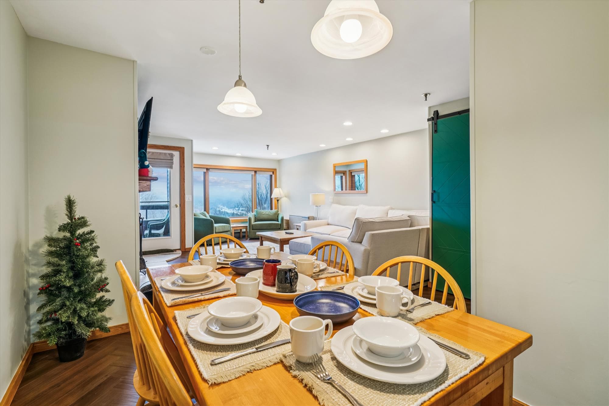 The dining area seats six comfortably and sits just steps from the living room, making it perfect for shared meals after a day on the mountain.