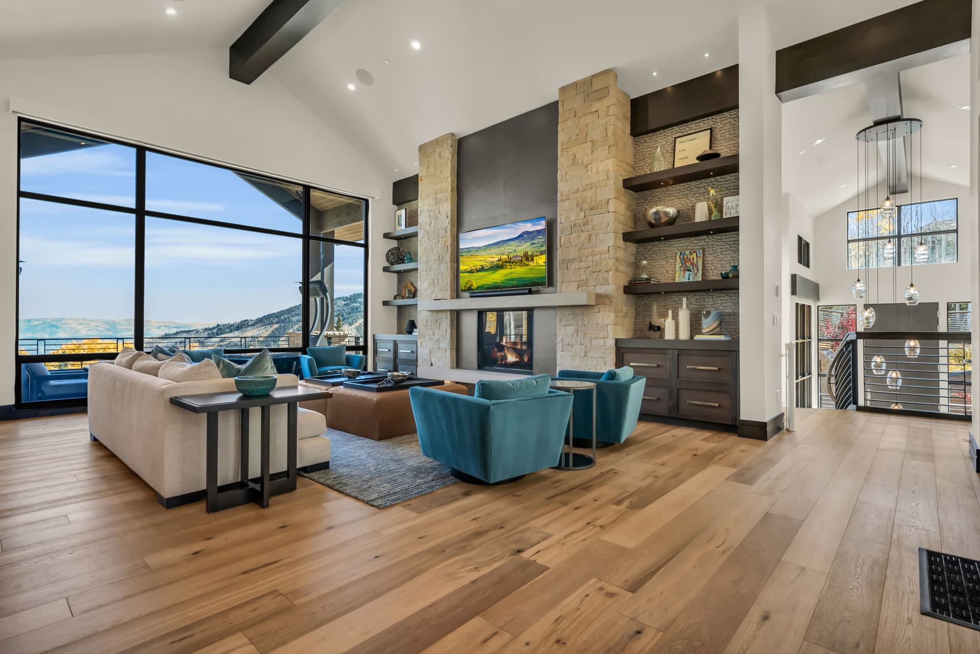 Sofa, Accent Chairs, TV, and Sliding Doors to the Walk Out Balcony