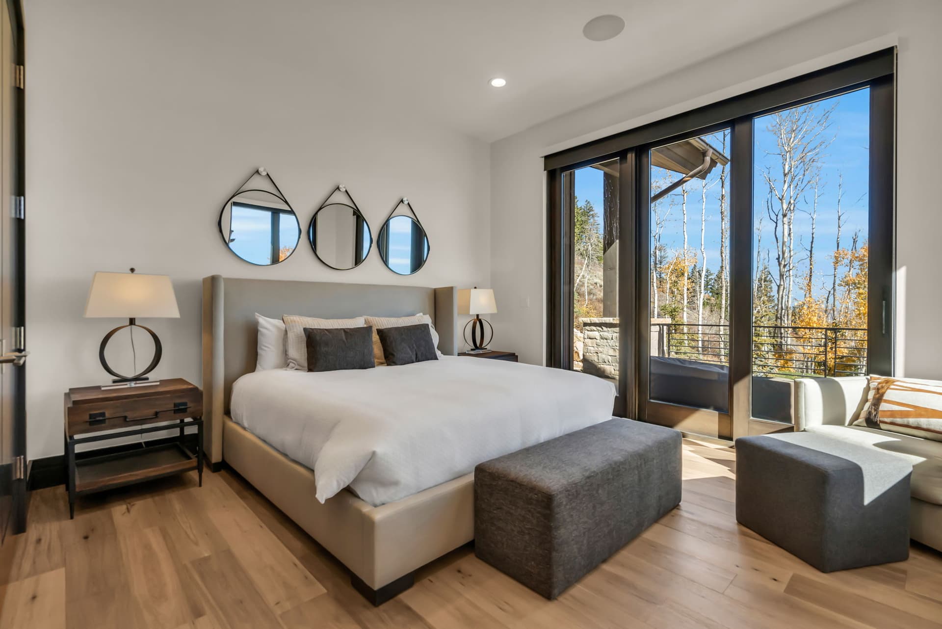 Bedroom with One Bed, Bedside Table, Lamp and Sliding Door to the Balcony
