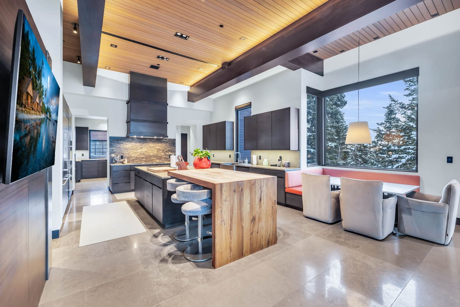 A modernkitchen with sleek finishes and mountain views.