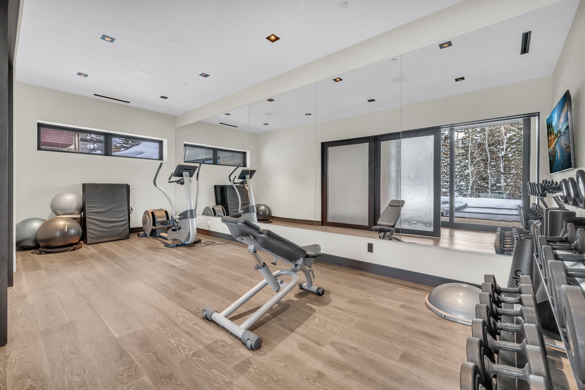 A modern  home gym with sleek finishes and natural light.
