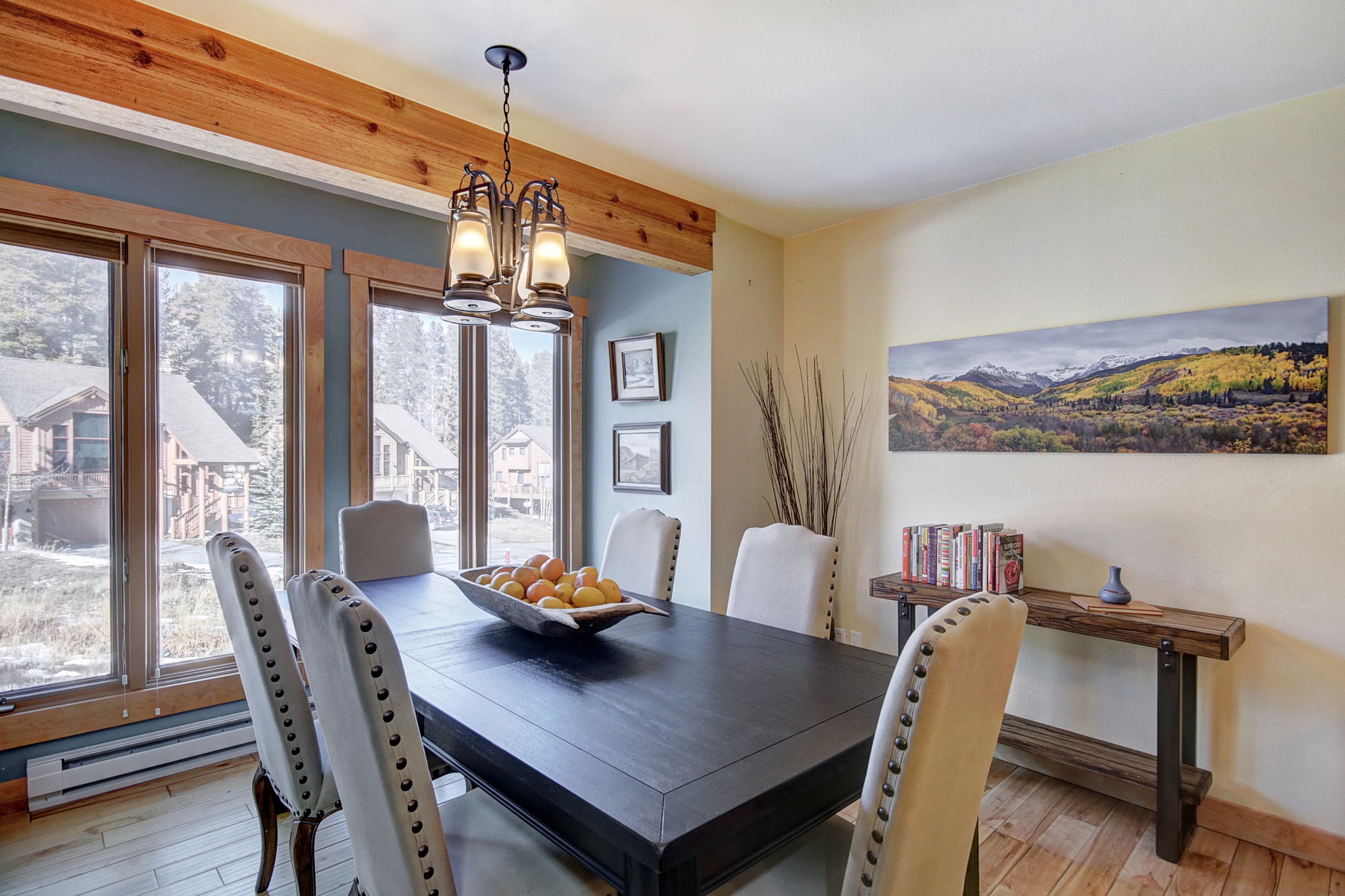 Watch the snow fall as you enjoy a meal at the dining table that can seat 10 - 4 O'Clock Lodge D26 Breckenridge Vacation Rental