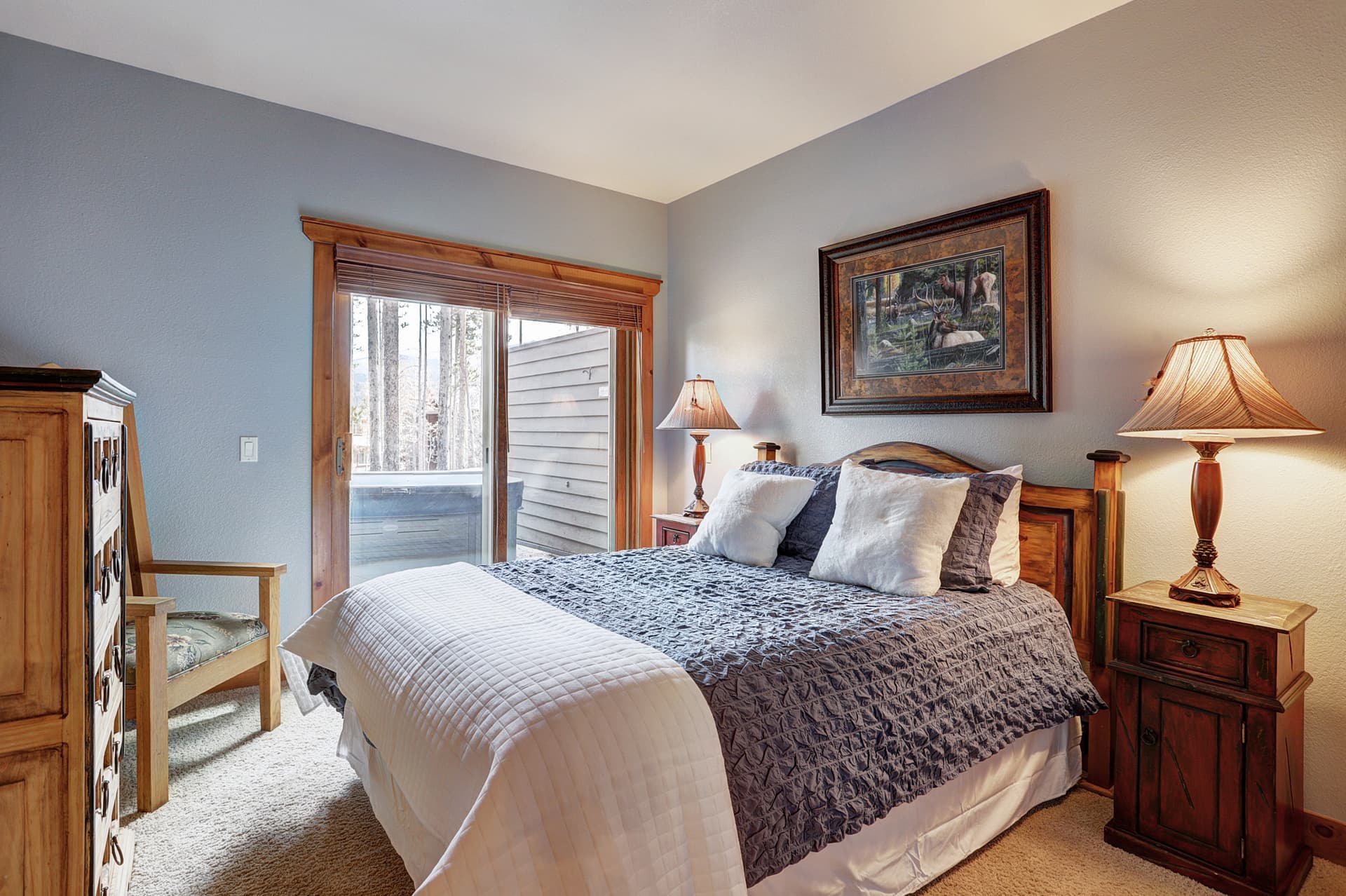 Second queen bedroom with private balcony that offers lots of natural light and secluded outdoor space, and access to the hot tub  - Amber Sky Breckenridge Vacation Rental