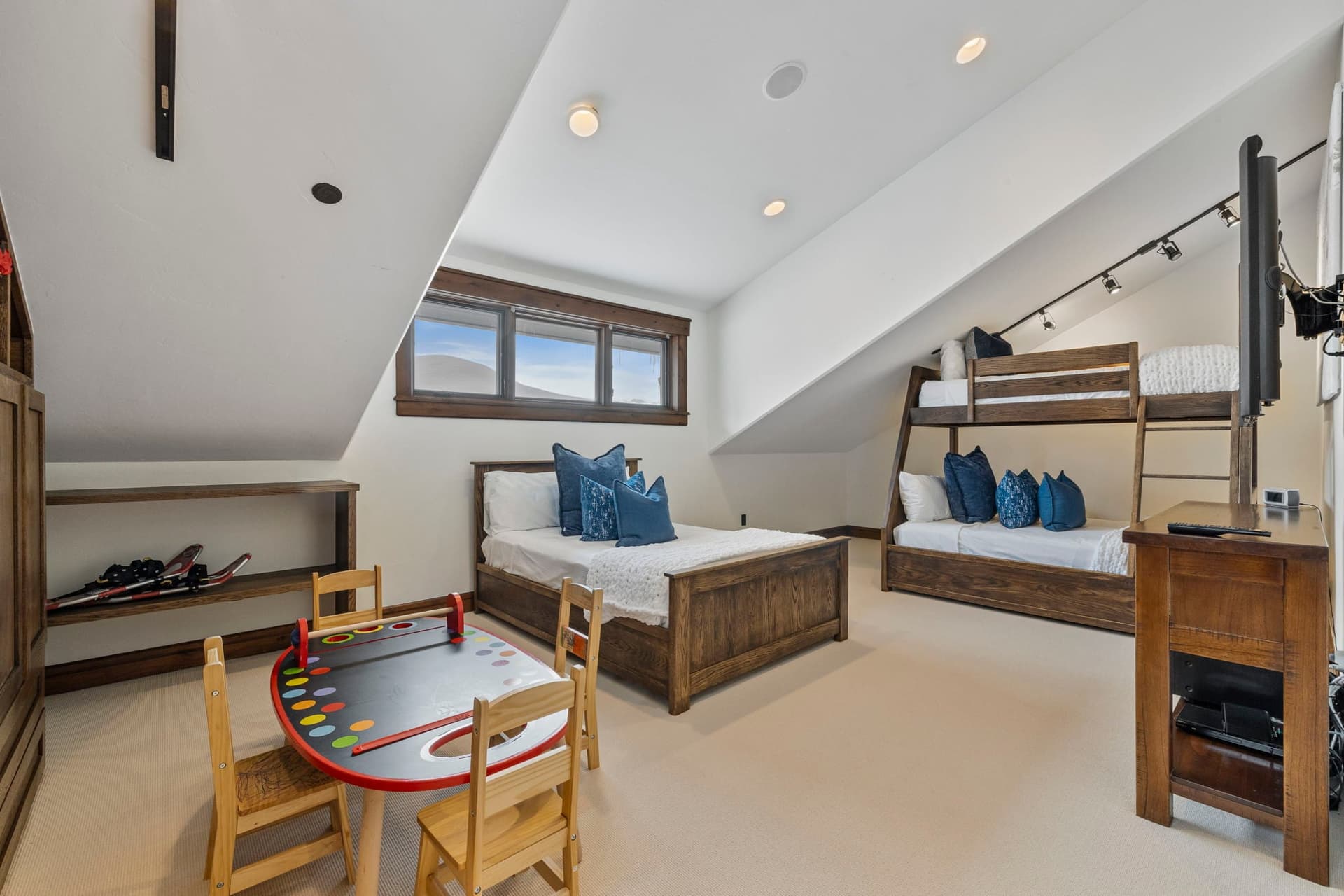 bunk suite with game table and 3 beds