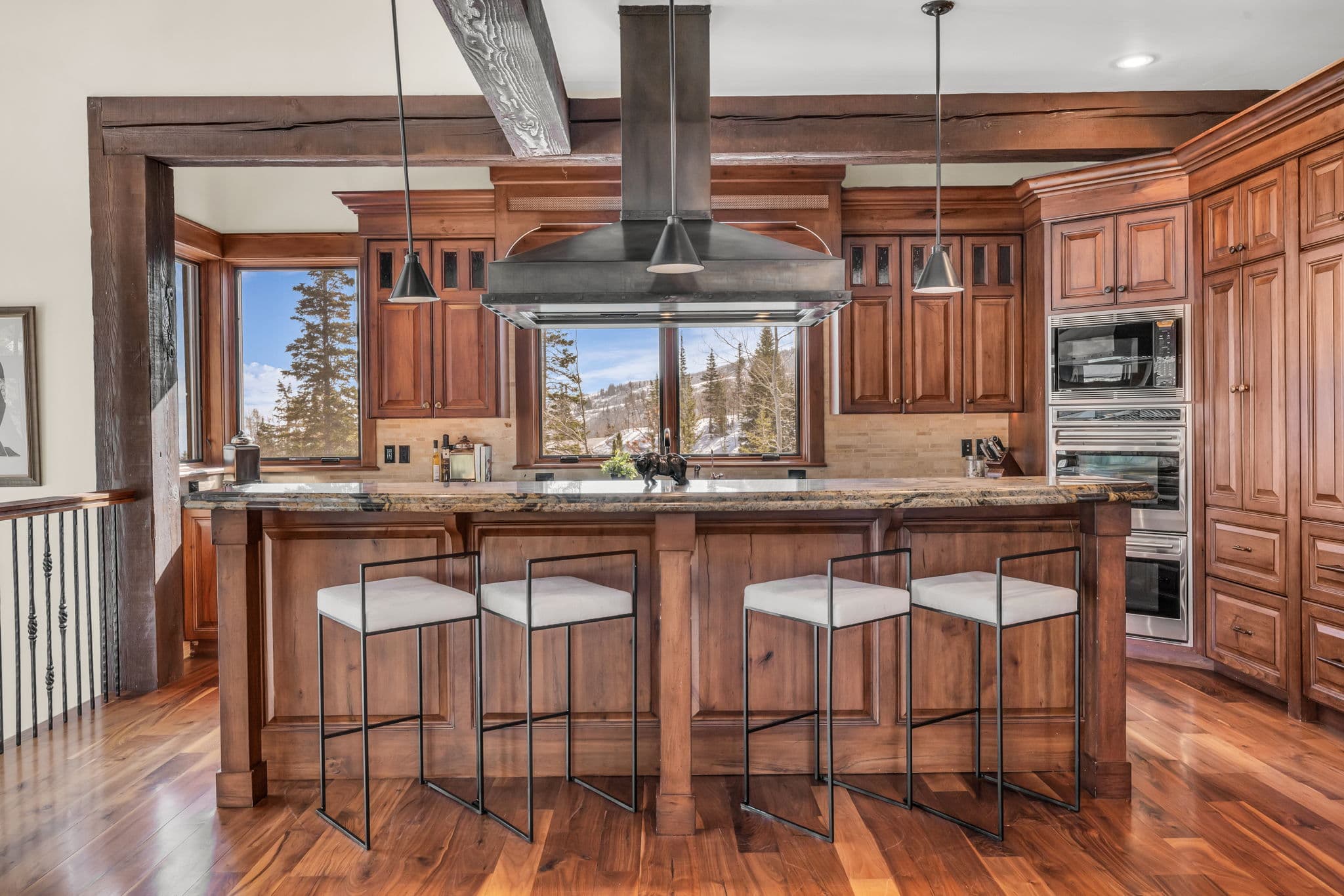 kitchen island facing large kitchen windows