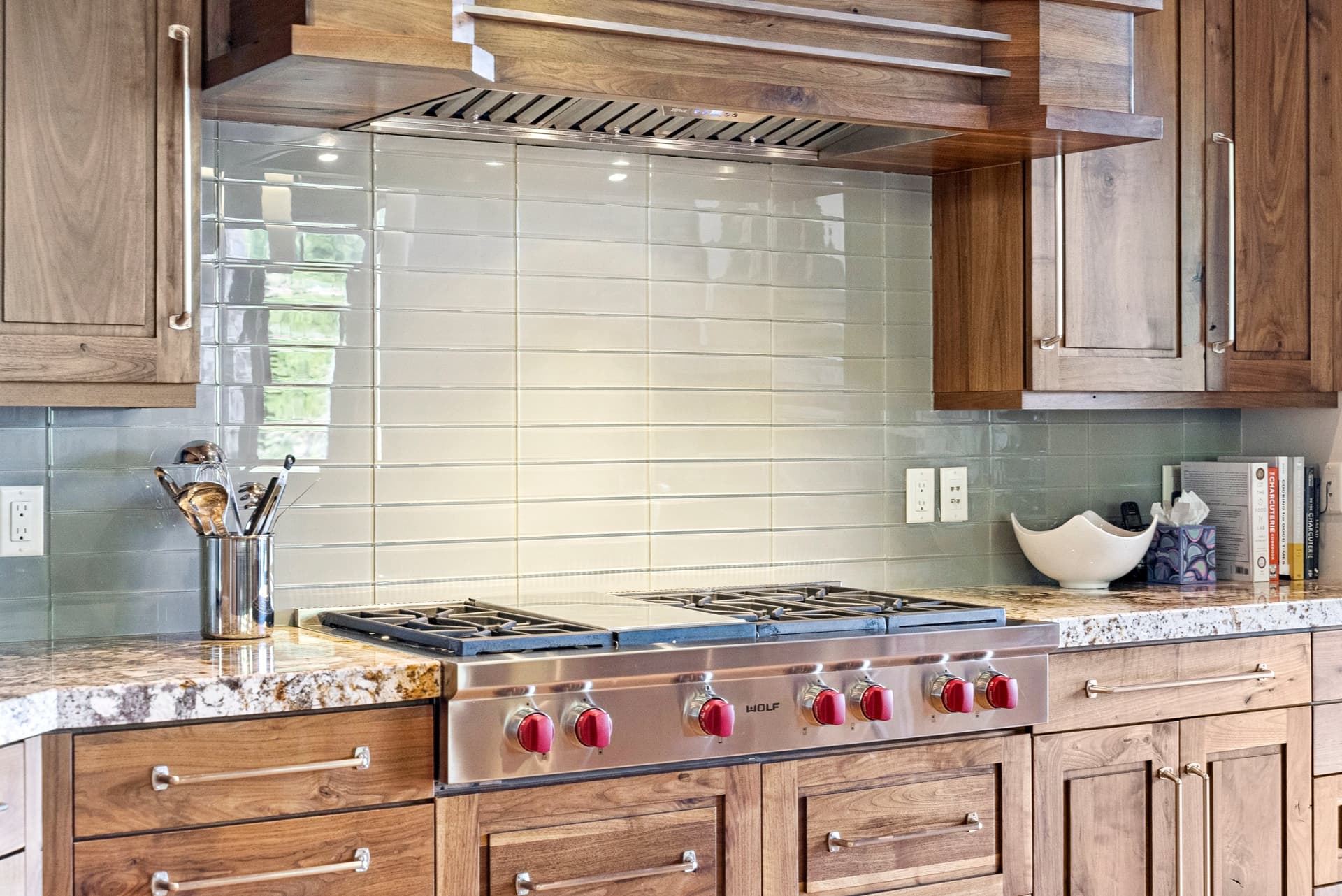 chefs stove with custom tile backsplash