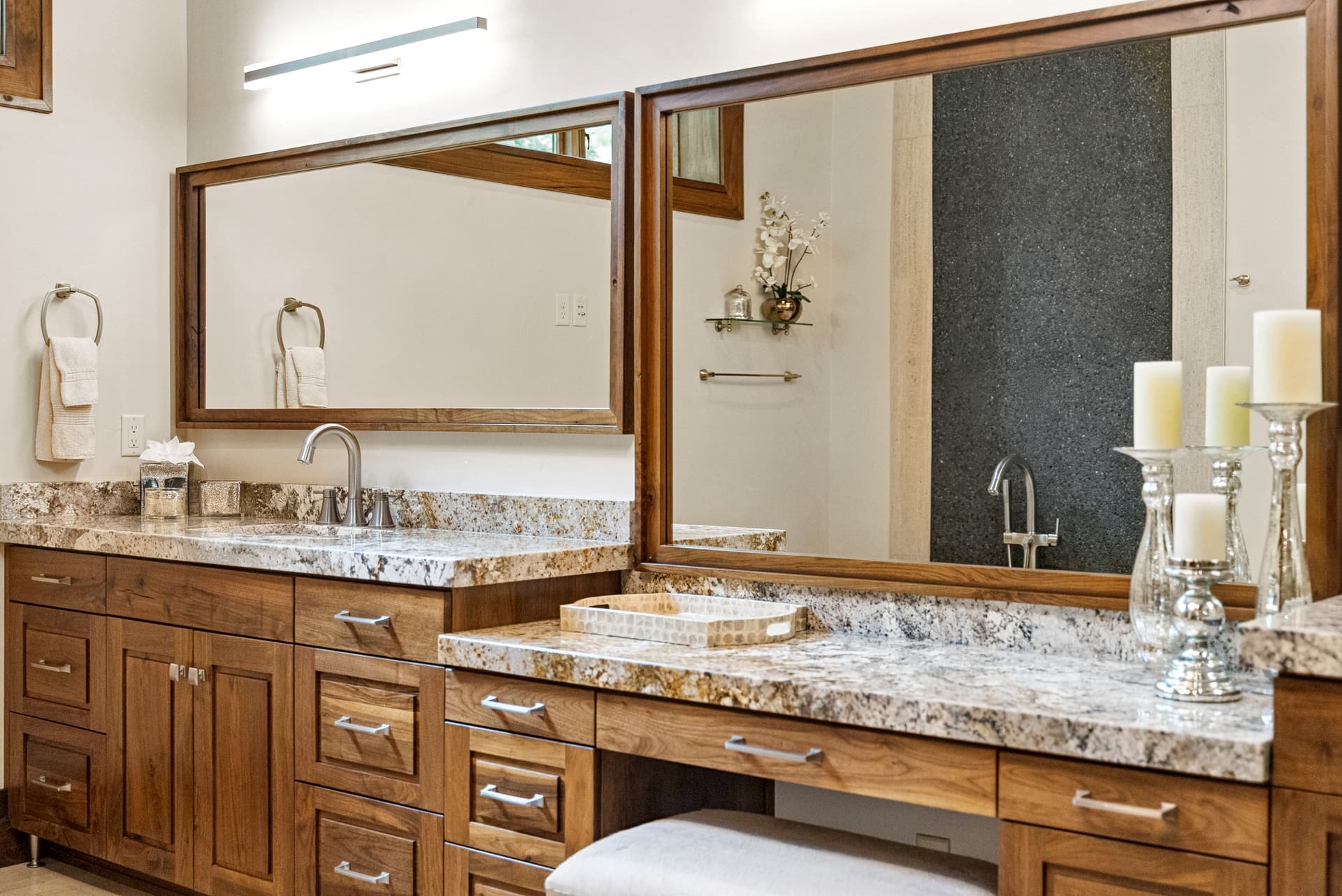luxury bathroom with large mirror and dual sink vaniites